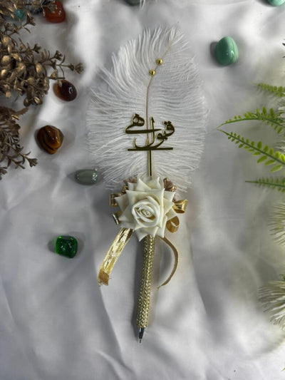 Handcrafted white and gold Nikah pen with feather, rose, and ribbon design by Nikkahday